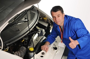 Mechanic servicing a car