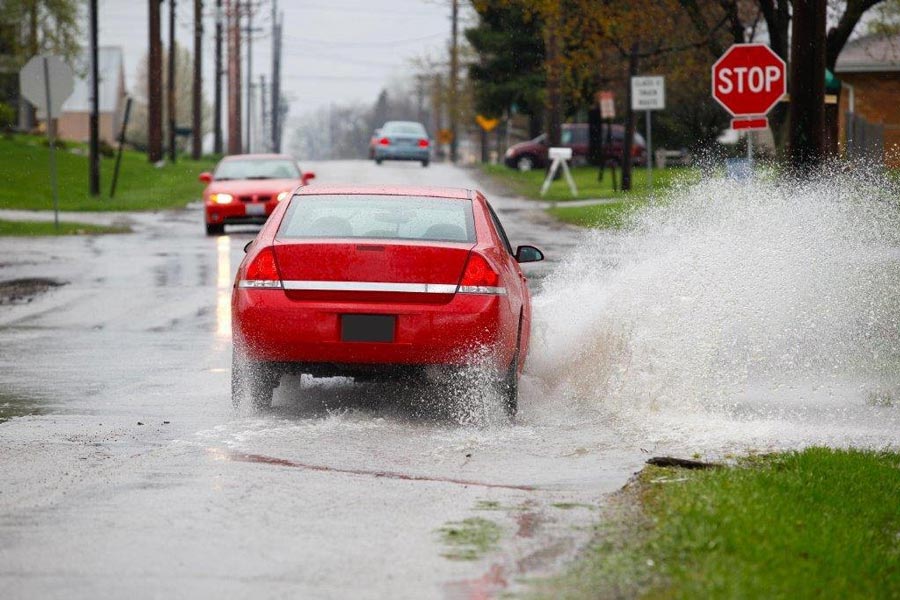 Car running on a rainy day