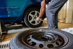 A mechanic changing a tire