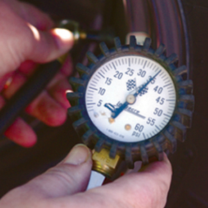 A man is using pressure gauge