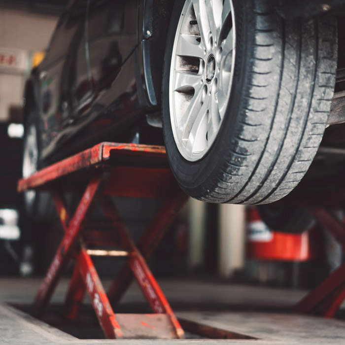 car elevated for mechanic repairs