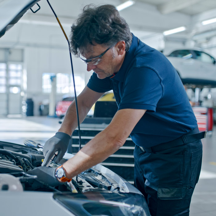 mechanic working on car